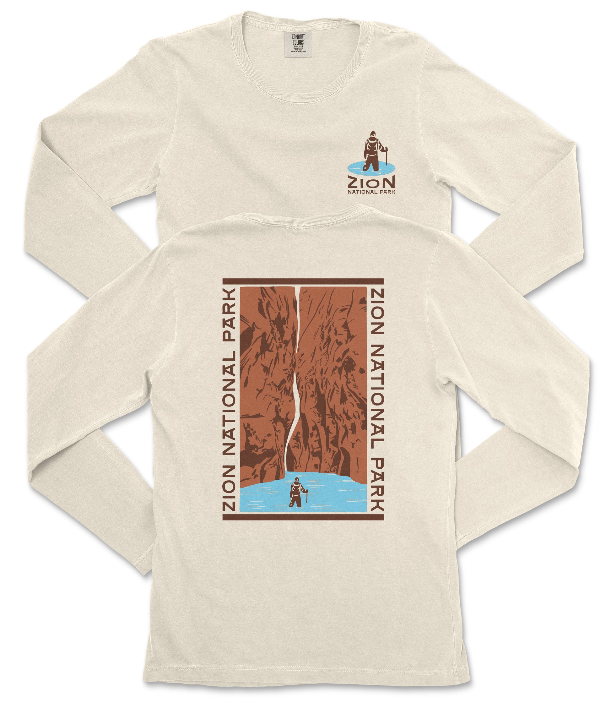 a white long-sleeved t-shirt with a graphic design depicting a person standing on a cliff overlooking a body of water.