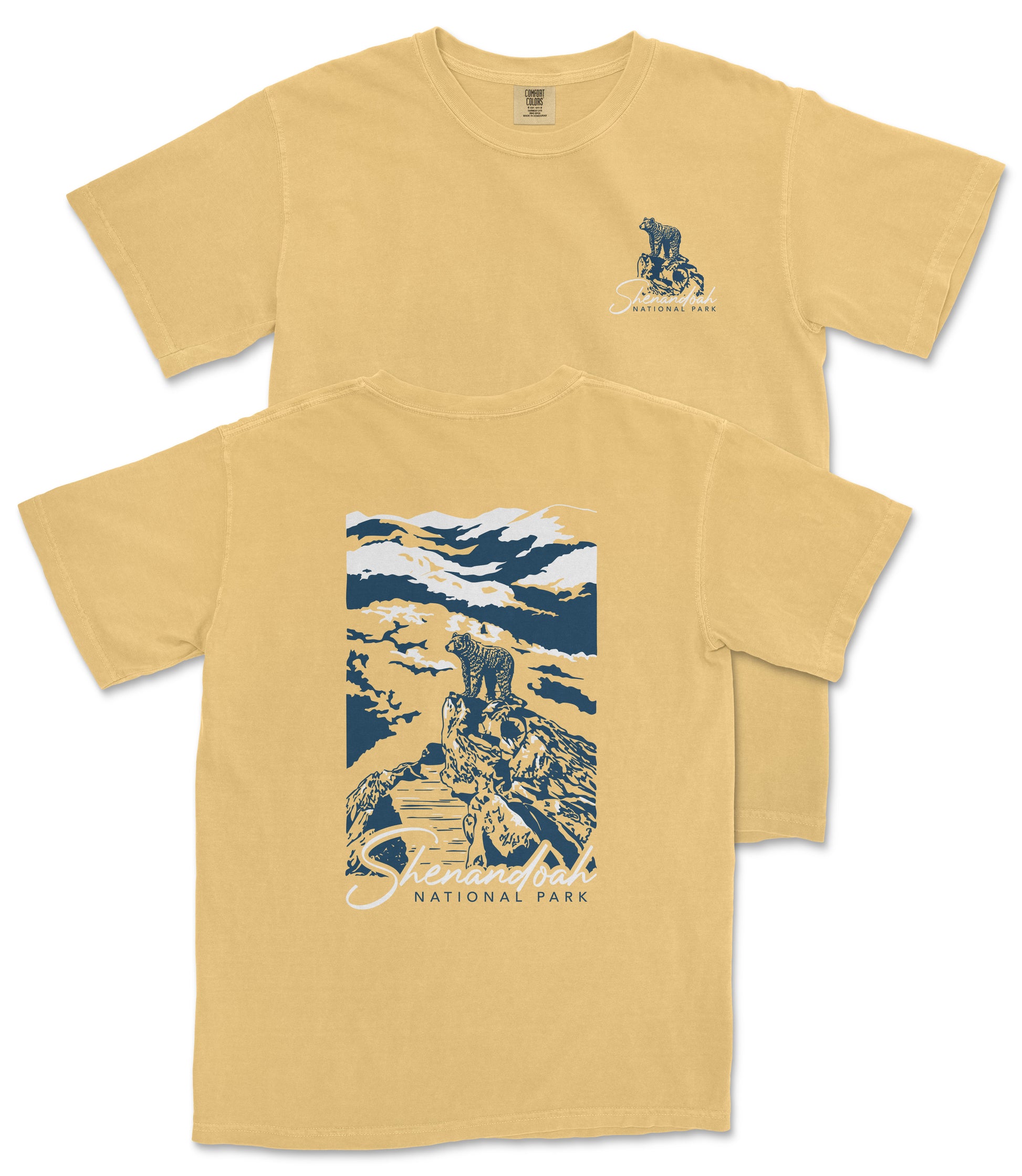 a yellow t-shirt with a graphic design depicting a person riding a bicycle on a trail in a mountainous landscape.