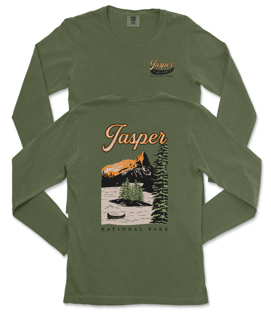 A green long-sleeved t-shirt with a graphic design depicting a mountain landscape and a canoe, along with the text "Jasper National Park" printed on the back.