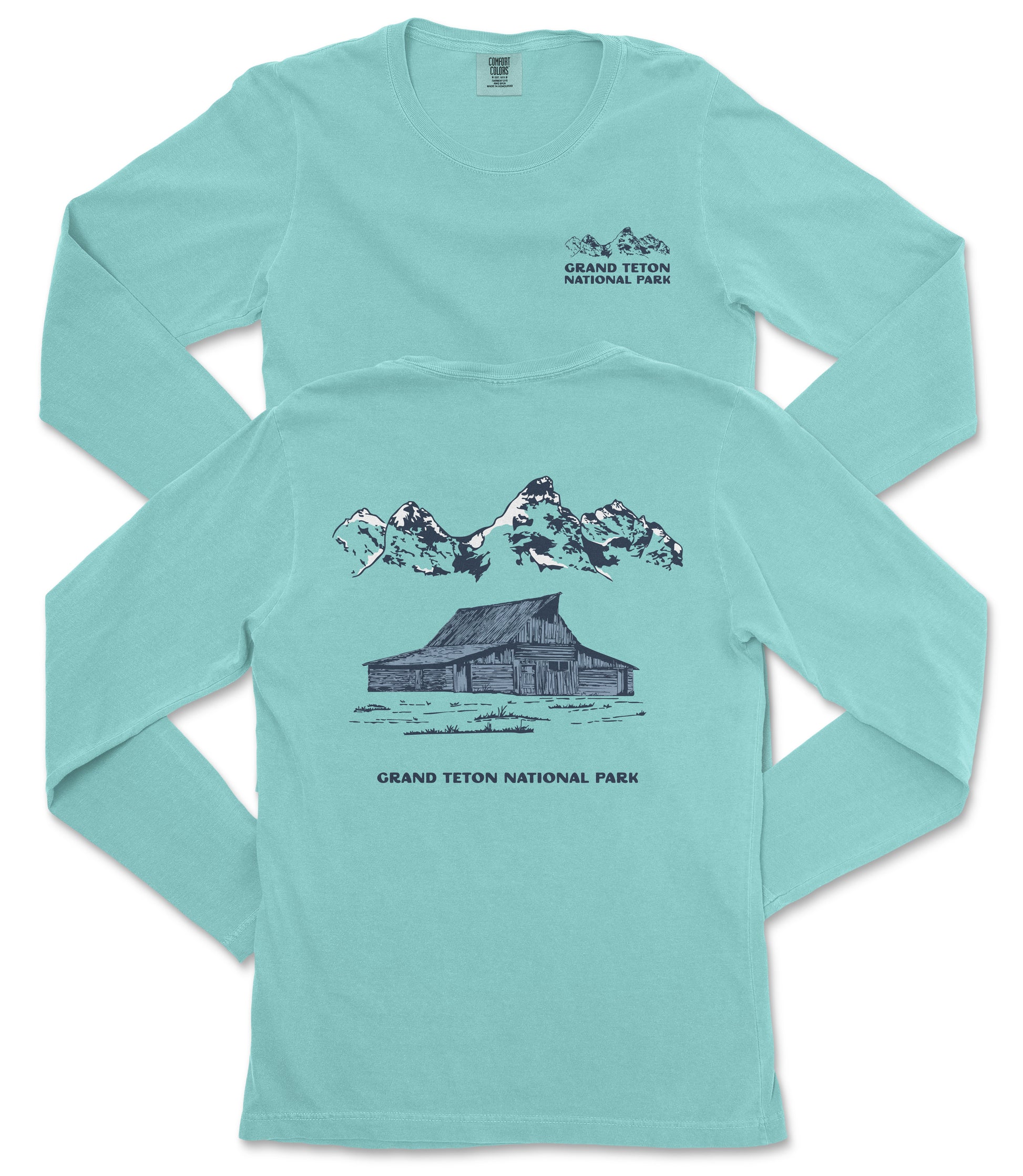 A turquoise long-sleeved t-shirt with a graphic design depicting a cabin and mountains, along with text that reads "Grand Teton National Park".