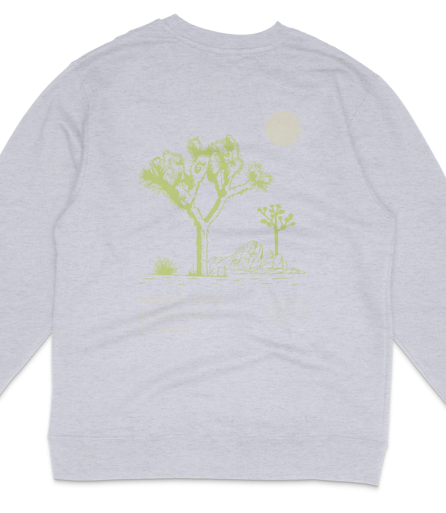 A gray sweatshirt with a graphic design depicting a desert landscape with trees and a cactus, along with a small white circle in the sky.