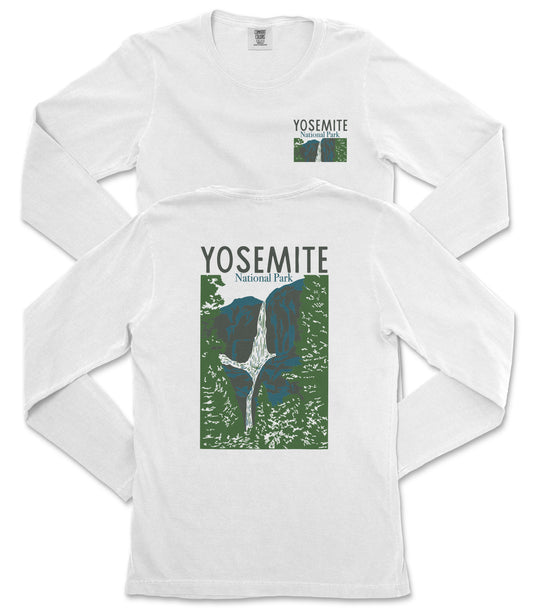A white long-sleeved t-shirt with a graphic design depicting a waterfall and mountains, along with the text "Yosemite National Park" printed on it.