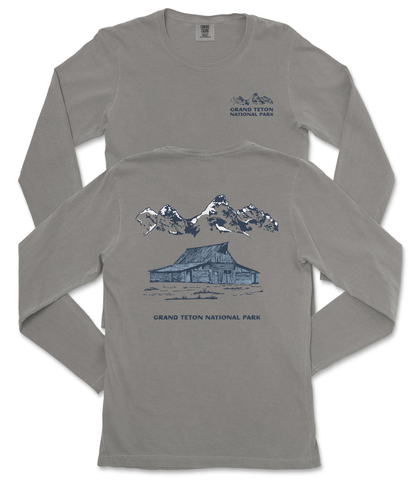 a gray long-sleeved t-shirt with a graphic design depicting a cabin and mountains, along with the text "Grand Teton National Park".