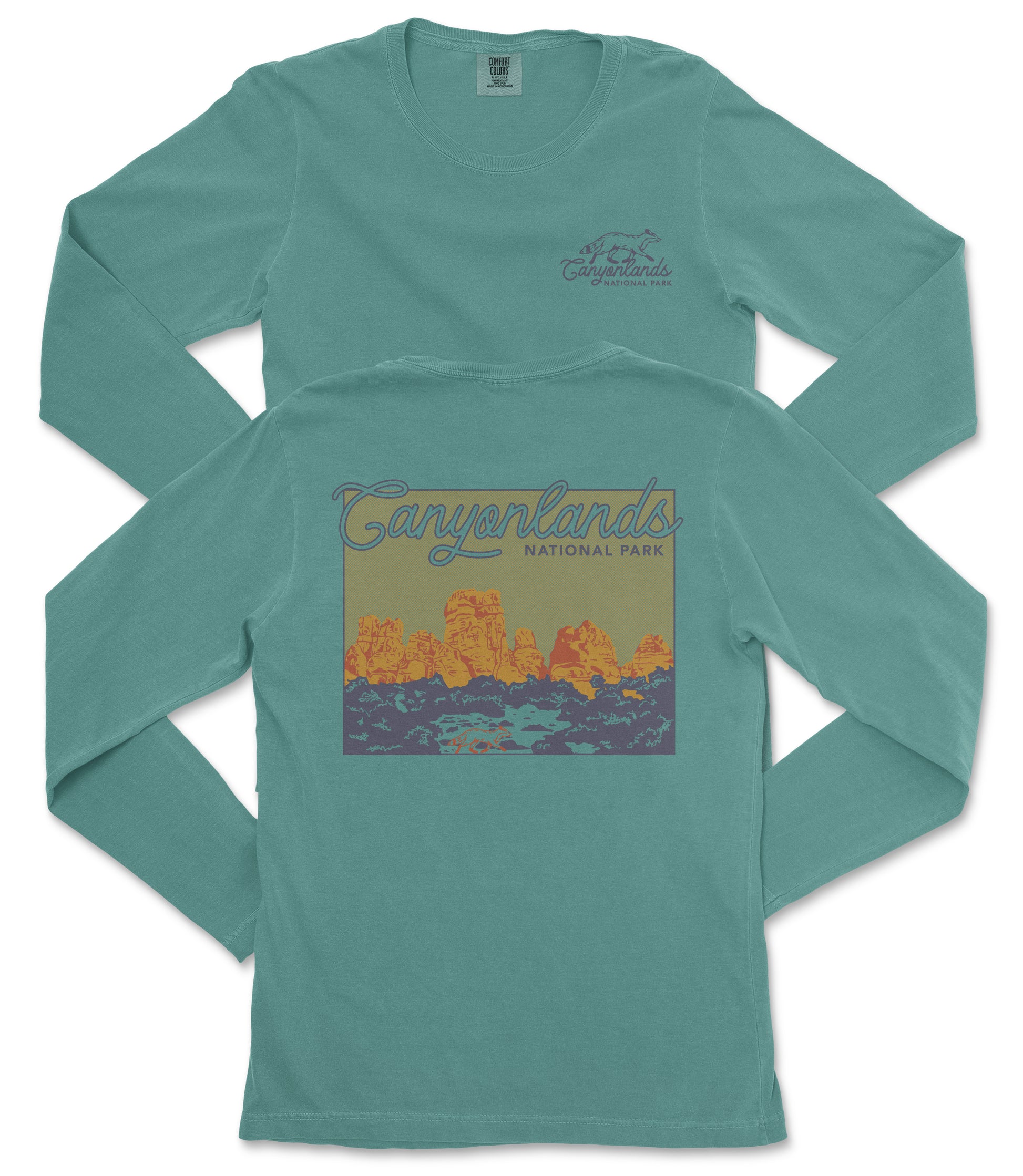 A turquoise long-sleeved t-shirt with a graphic design depicting a scenic landscape, specifically the Canylands National Park.