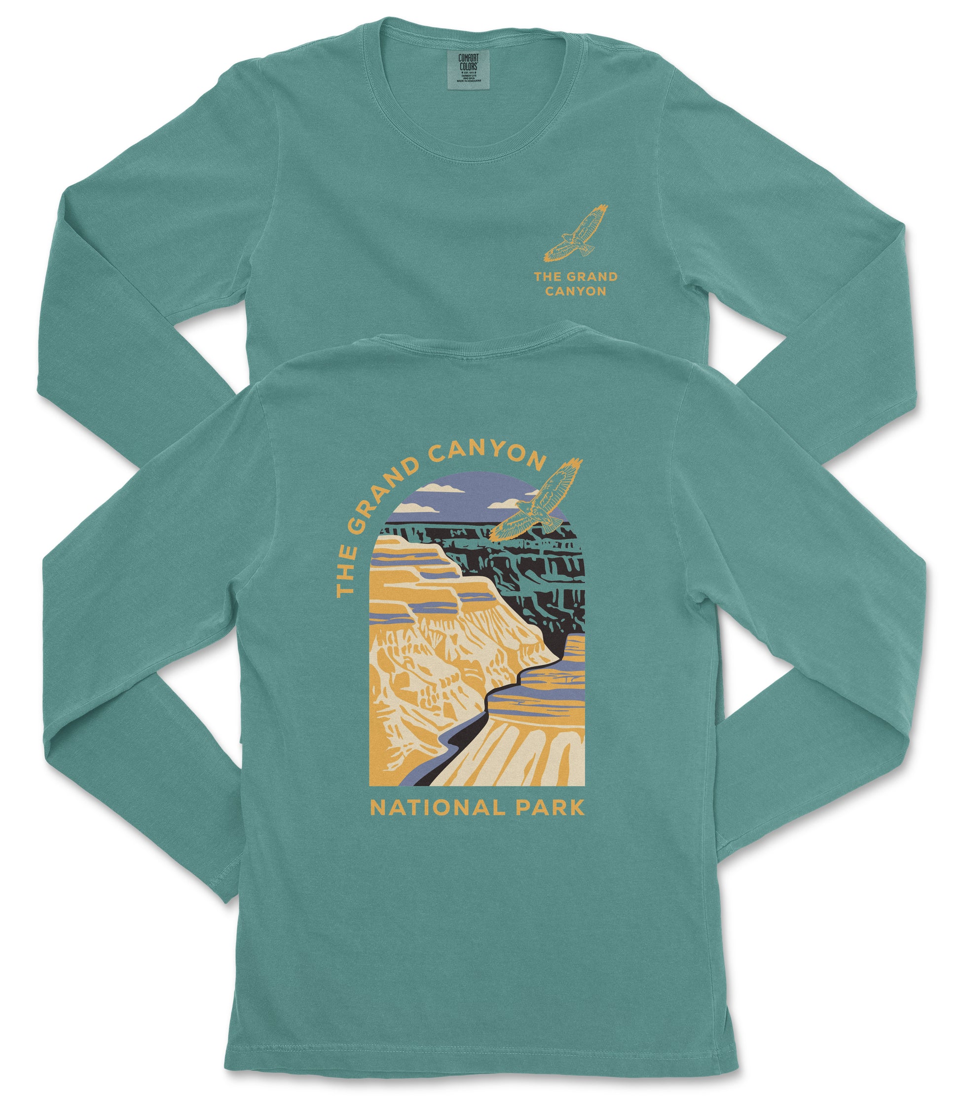 A long-sleeved teal-colored t-shirt with a graphic design depicting the Grand Canyon and the text "The Grand Canyon National Park" printed on it.