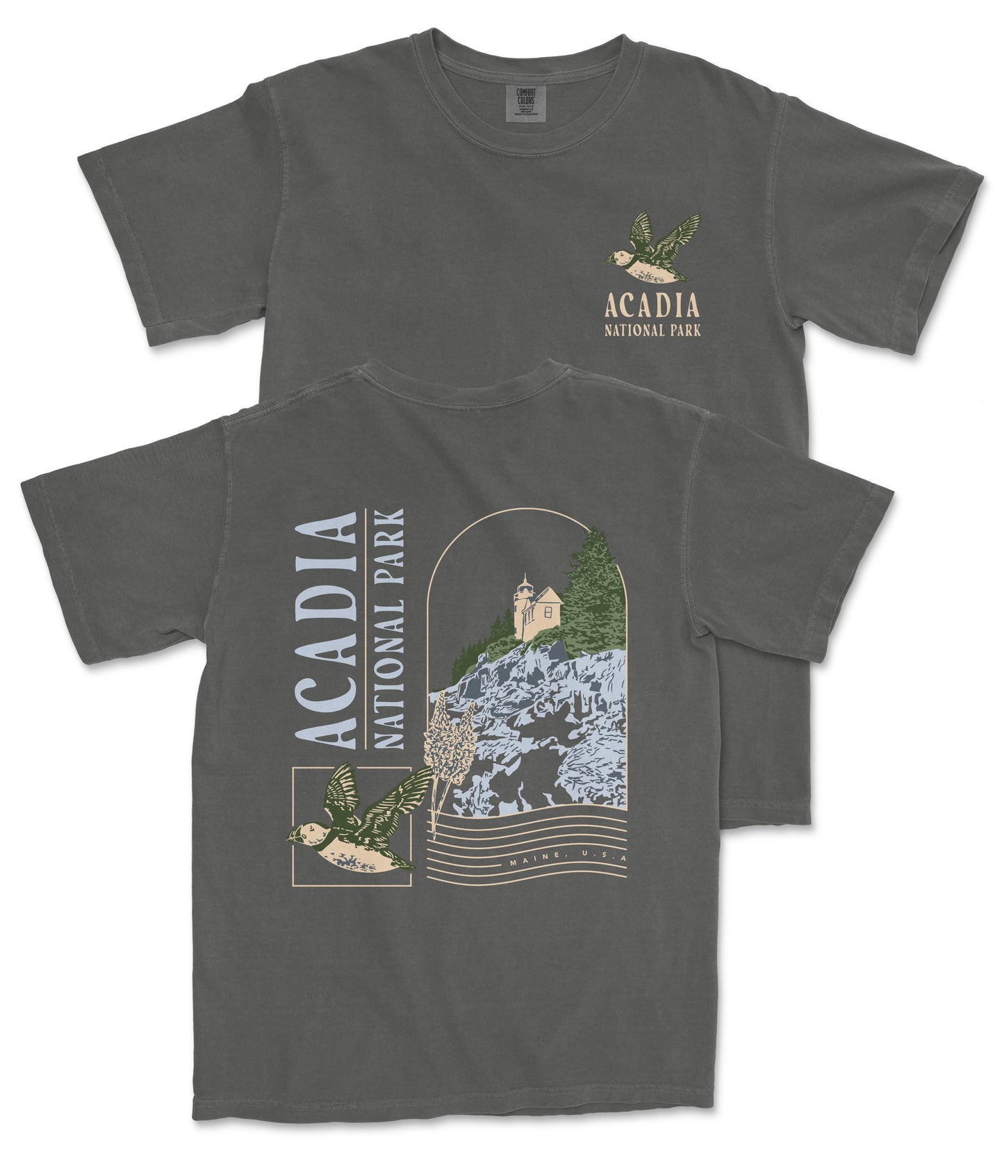a gray t-shirt with a graphic design depicting a scenic view of Acadia National Park, including a mountain, trees, and a bird.