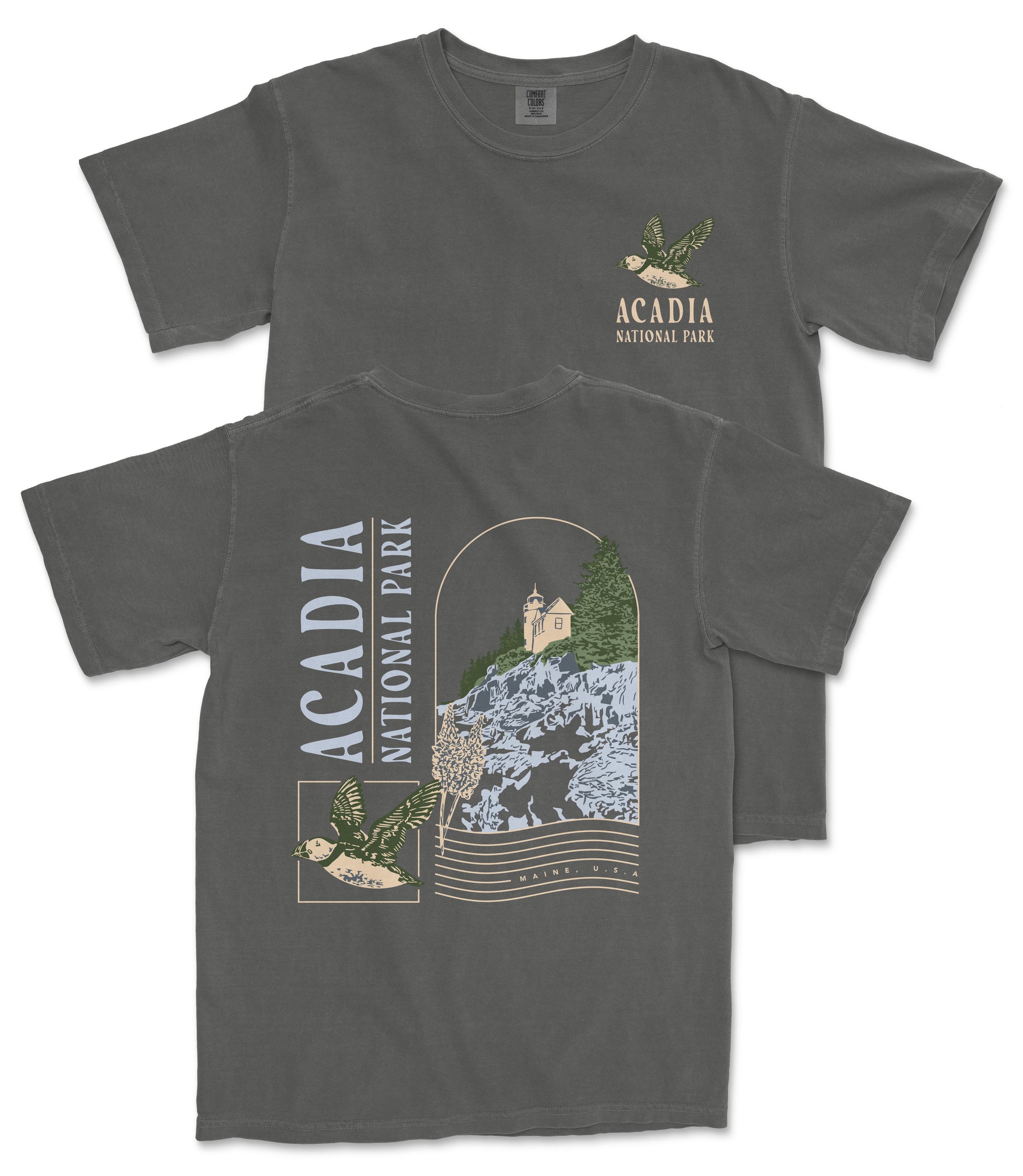 a gray t-shirt with a graphic design depicting a scenic view of Acadia National Park, including a mountain, trees, and a bird.