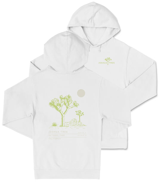 A white hooded sweatshirt with a graphic design depicting a desert landscape with a tree and a moon.