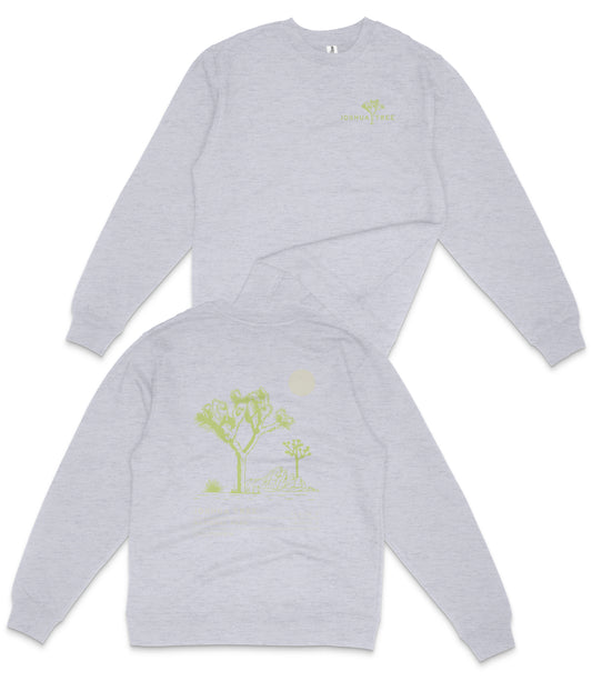 a grey long-sleeved shirt with a graphic design on the back, depicting a tree and a moon.