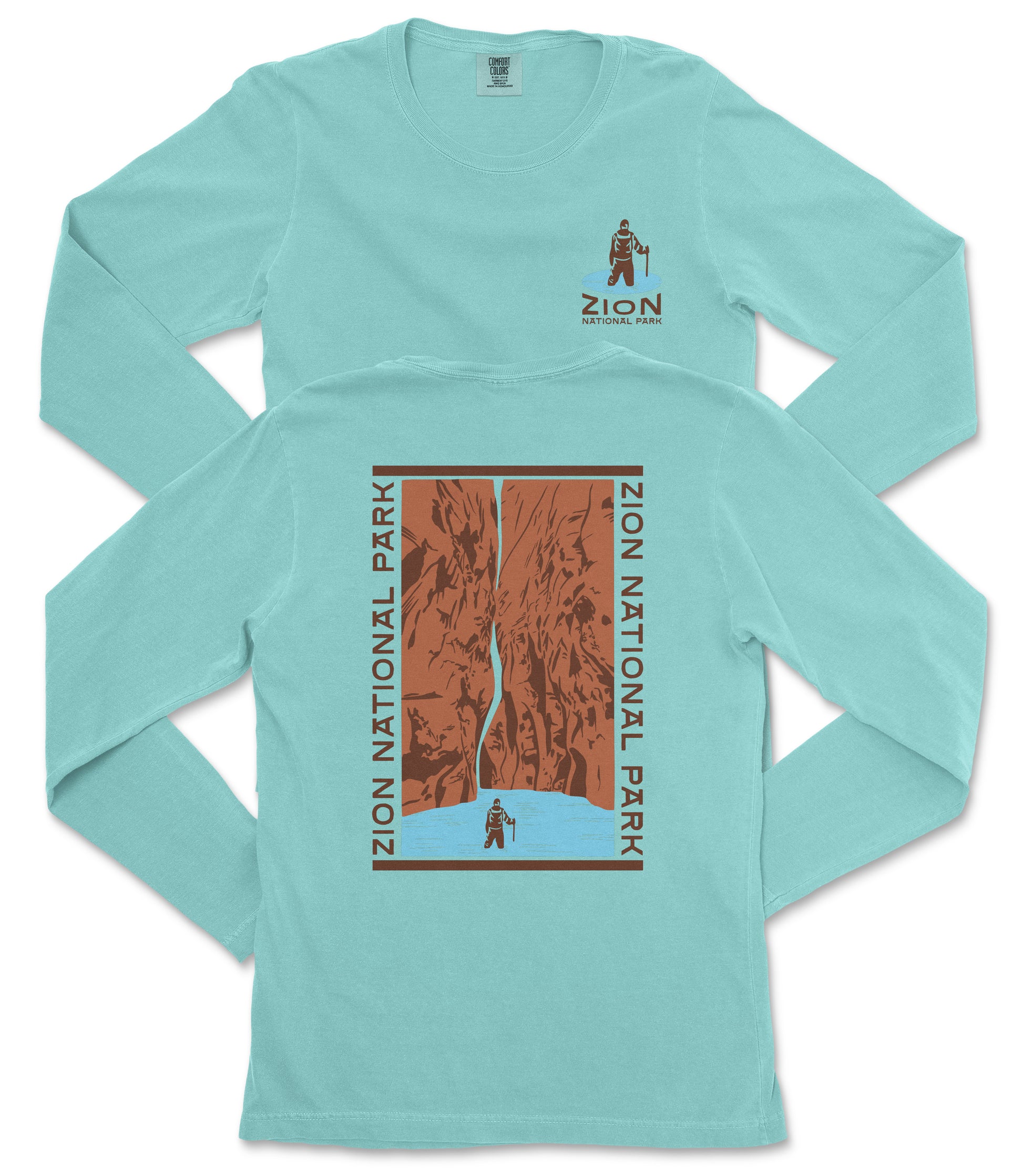 A turquoise long-sleeve t-shirt with a graphic design depicting a person standing in front of a canyon or waterfall.