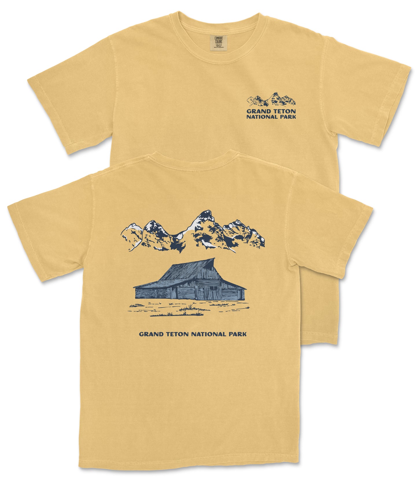 A yellow t-shirt with a graphic design depicting a cabin and mountains, along with the text "Grand Teton National Park".