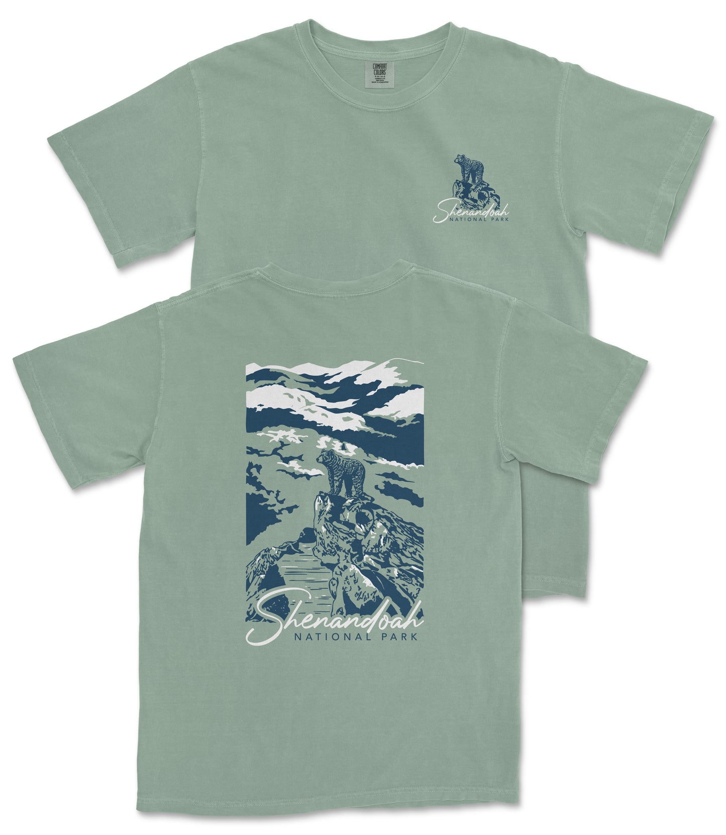 A green t-shirt with a graphic design depicting a mountain landscape and a person standing on a rock.