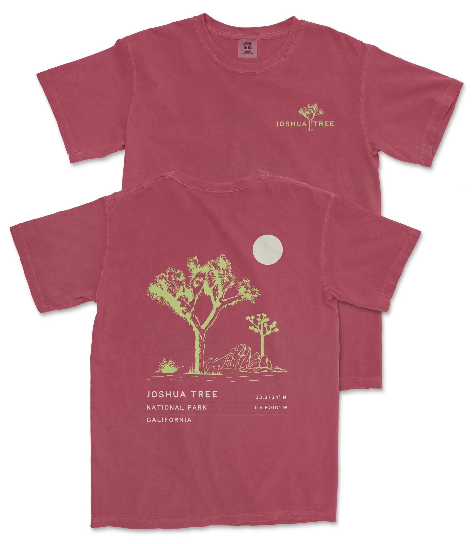 a red t-shirt with a graphic design depicting a desert landscape, including a tree and a moon. The text on the t-shirt reads "JOSUA TREE", "33.746 N", "California", and "115.907 W".