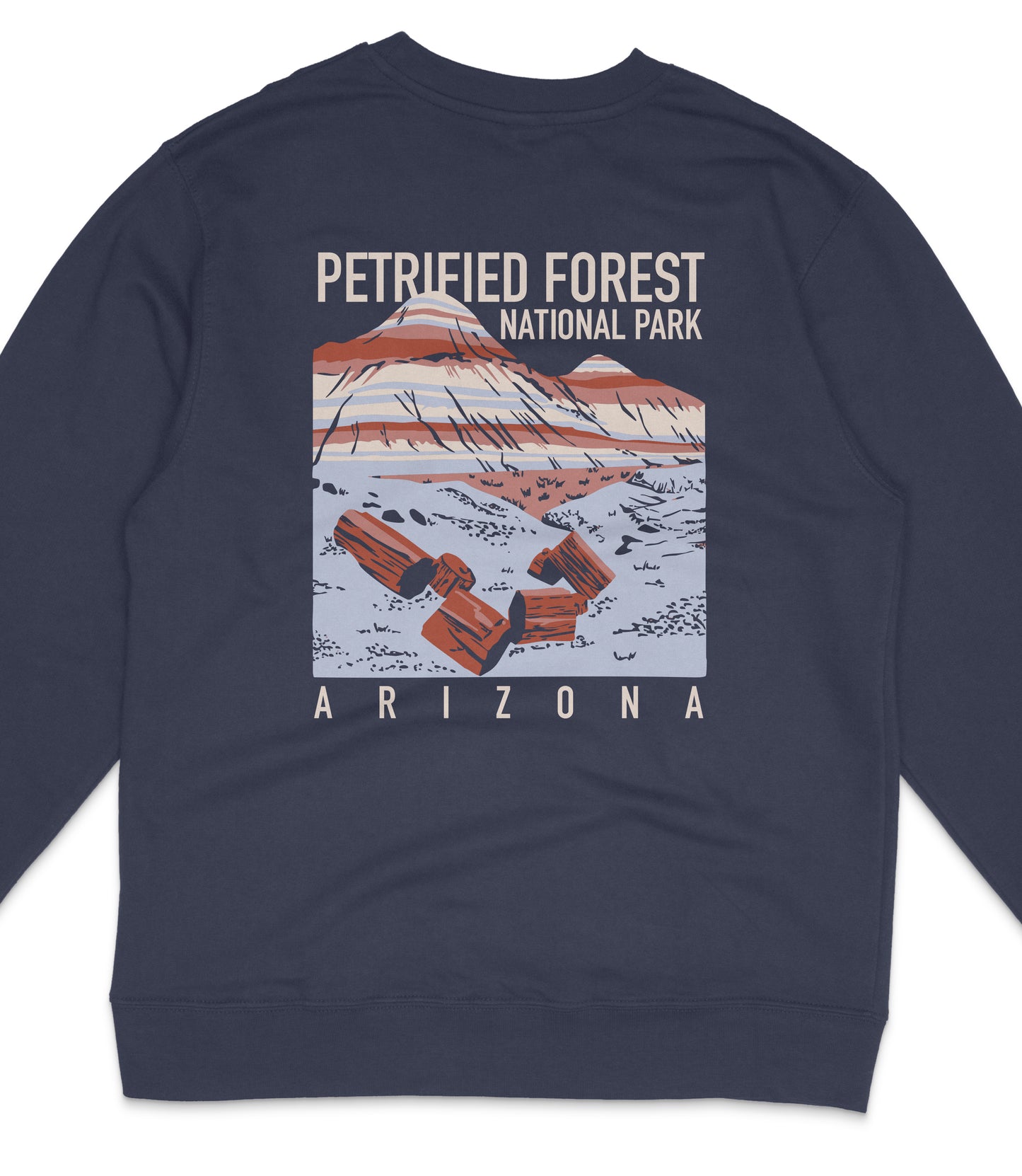 The image is a graphic design of a sweater featuring a mountain landscape with a text overlay that reads "PETRIFIED FOREST NATIONAL PARK ARIZONA".