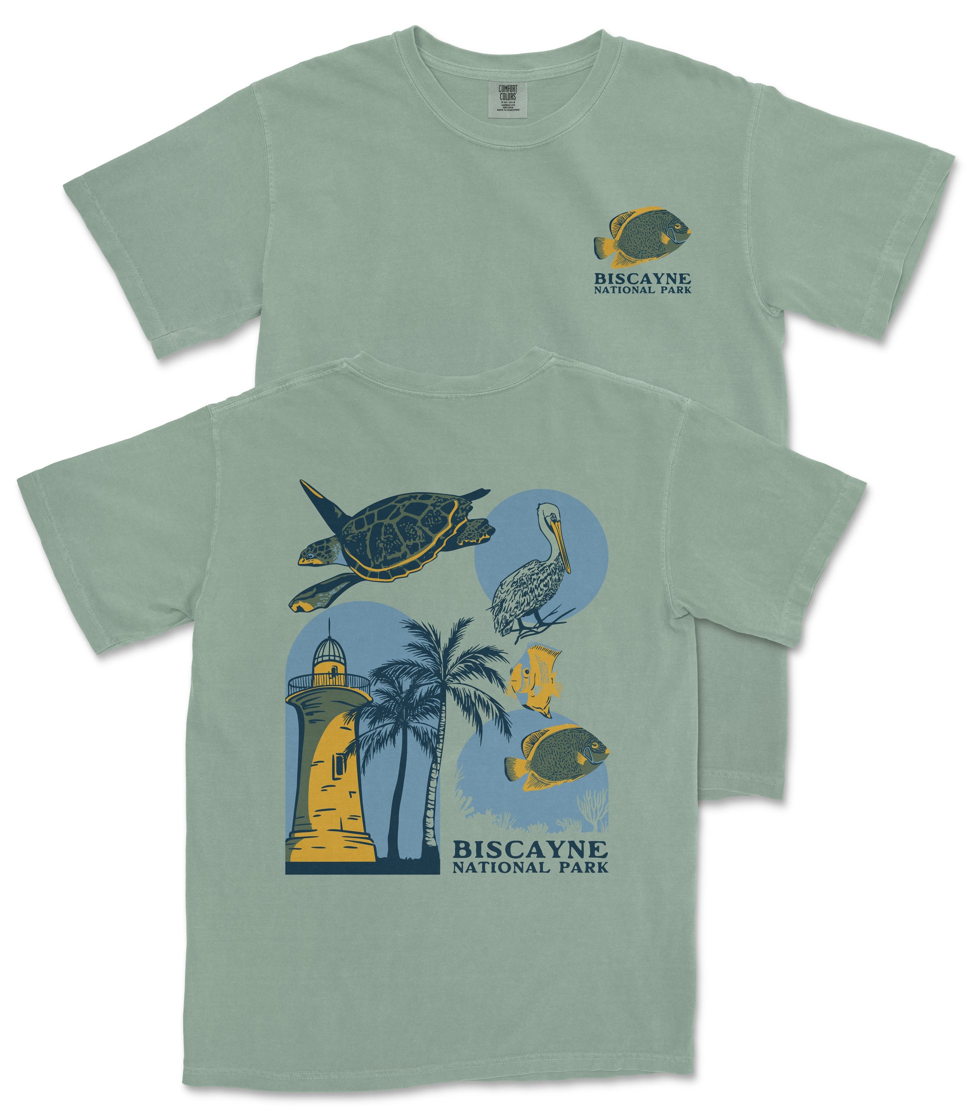 A green t-shirt with a graphic design depicting various elements associated with Biscayne National Park, including a lighthouse, palm trees, and tropical birds.
