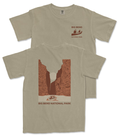 a beige t-shirt with a graphic design depicting a canyon or rock formation, along with text that reads "Big Bend National Park".