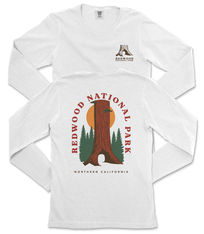 a white long-sleeved t-shirt with a graphic design depicting a redwood tree and the text "REDWOOD NATIONAL PARK NORTHERN CALIFORNIA".