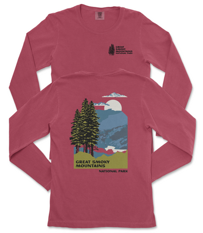 A red long-sleeved t-shirt with a graphic design depicting a mountain landscape with pine trees, a full moon, and clouds. The text on the t-shirt reads "GREAT SMOKY MOUNTAINS NATIONAL PARK".