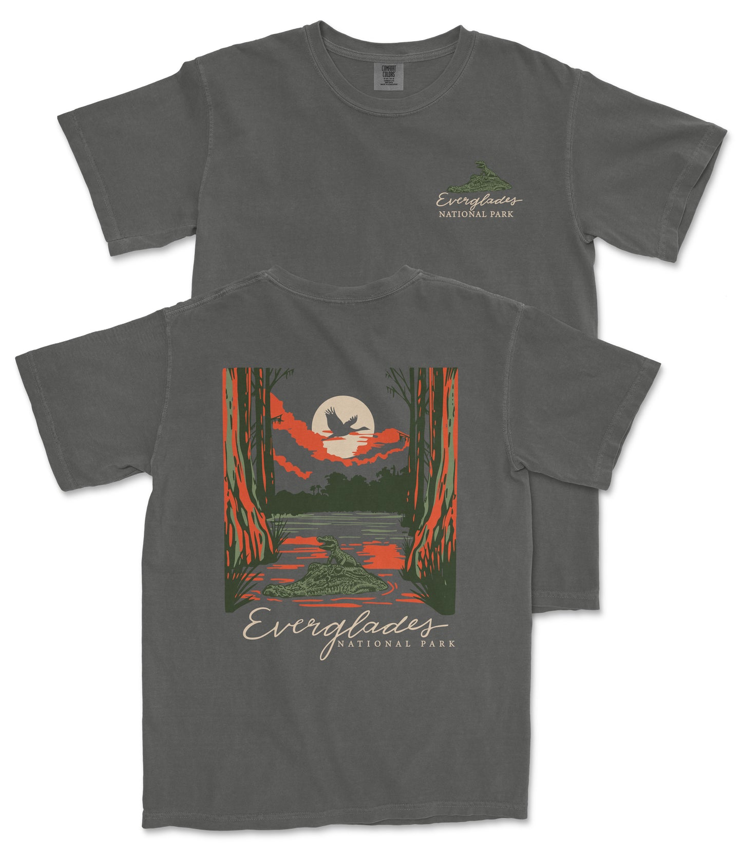 a gray t-shirt with a graphic design depicting a scenic landscape with a lake, trees, and a bird in flight. The text on the t-shirt reads "EVERGLADES NATIONAL PARK".
