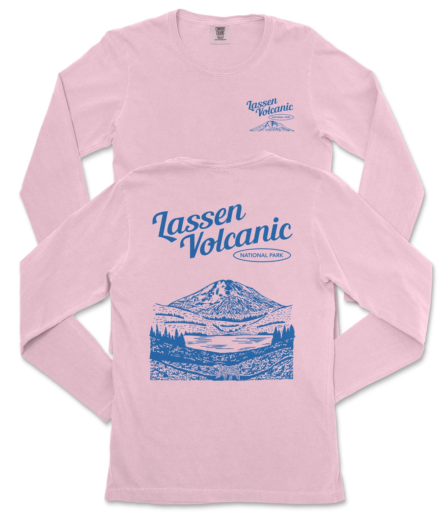 A pink long-sleeved t-shirt with a graphic design depicting a mountain landscape and a lake, along with the text "Lassen Volcanic National Park" printed on the back.