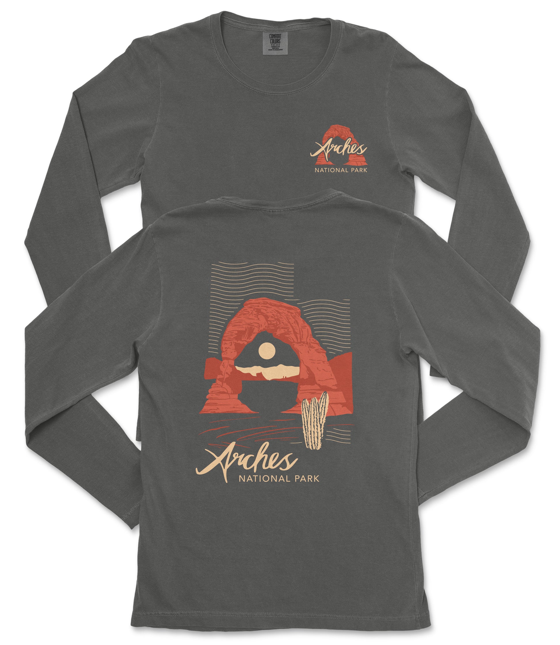 a gray long-sleeved t-shirt with a graphic design depicting a desert landscape, including a rock formation and a cactus. The text on the t-shirt reads "Arches National Park".
