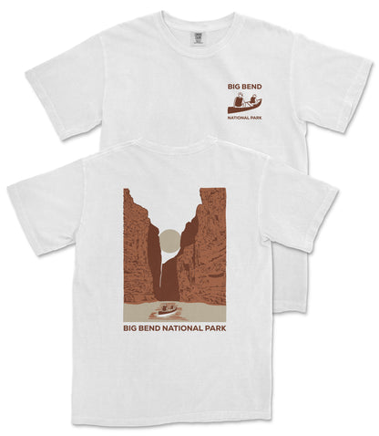 A white t-shirt with a graphic design depicting a canyon landscape and a boat on a river, along with the text "BIG BEND NATIONAL PARK".