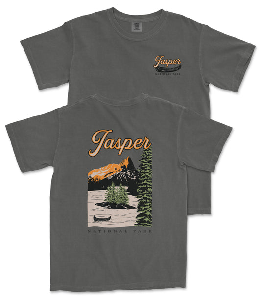 a gray t-shirt with a graphic design depicting a scenic landscape with mountains, a lake, and a canoe. The text on the t-shirt reads "Jasper National Park" and "National Park".