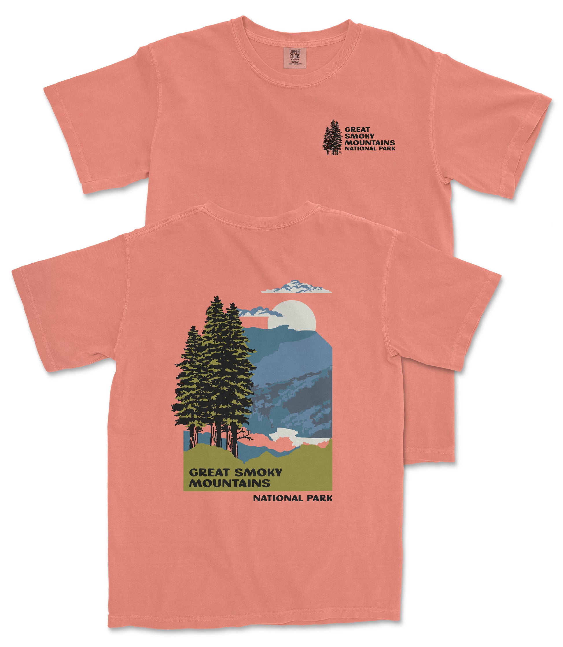 a pink t-shirt with a graphic design depicting a scenic mountain landscape with pine trees, mountains, and a full moon.