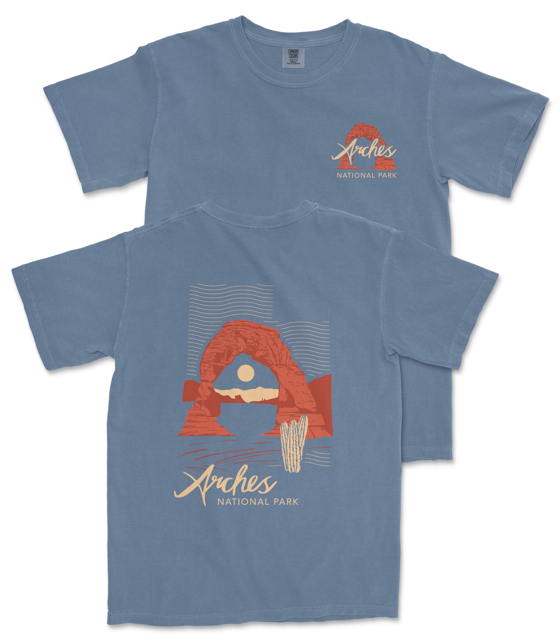 a blue t-shirt with a graphic design depicting a desert landscape with a red rock formation and a cactus. The text on the t-shirt reads "Arches National Park".