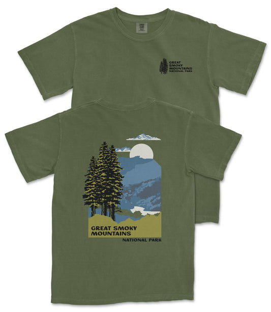 A green t-shirt with a graphic design depicting a mountain landscape with pine trees, a full moon, and clouds. The text on the t-shirt reads "GREAT SMOKY MOUNTAINS NATIONAL PARK".