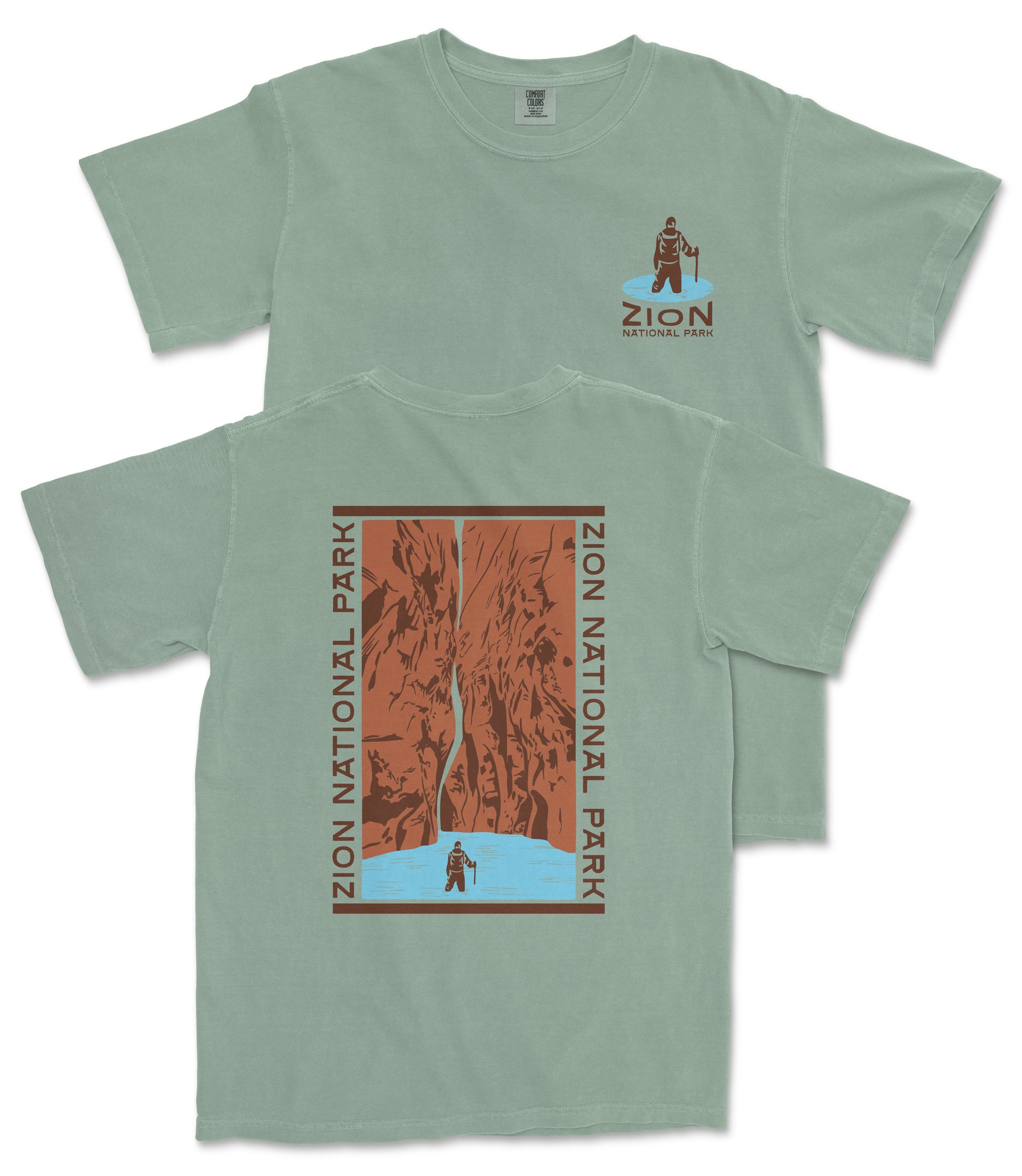 A green t-shirt with a graphic design depicting a person standing in front of a waterfall, surrounded by the text "ZION NATIONAL PARK".