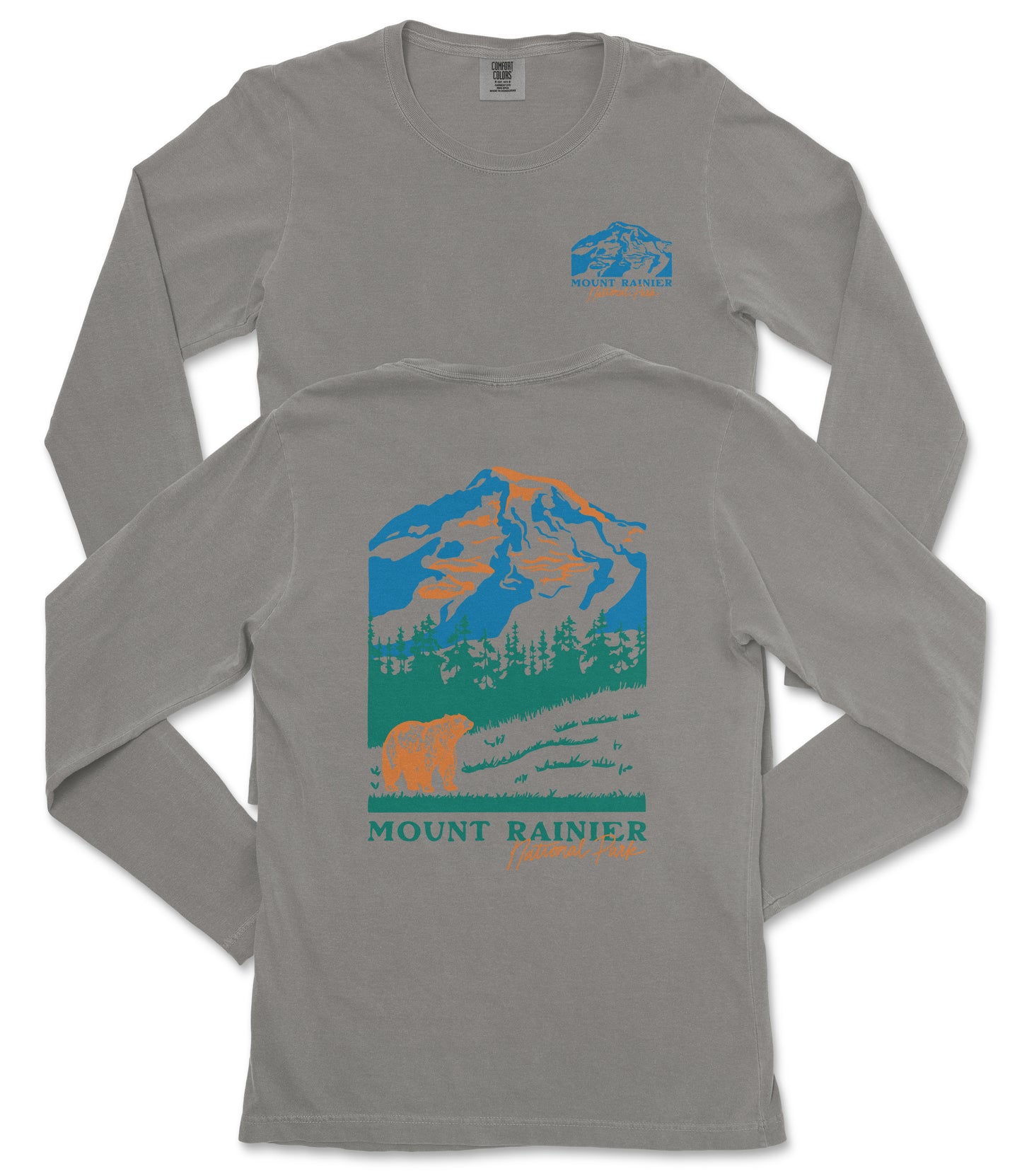 a gray long-sleeved t-shirt with a graphic design depicting a mountain landscape, including a bear and trees. The text "MOUNT RAINIER" is printed below the mountain graphic.
