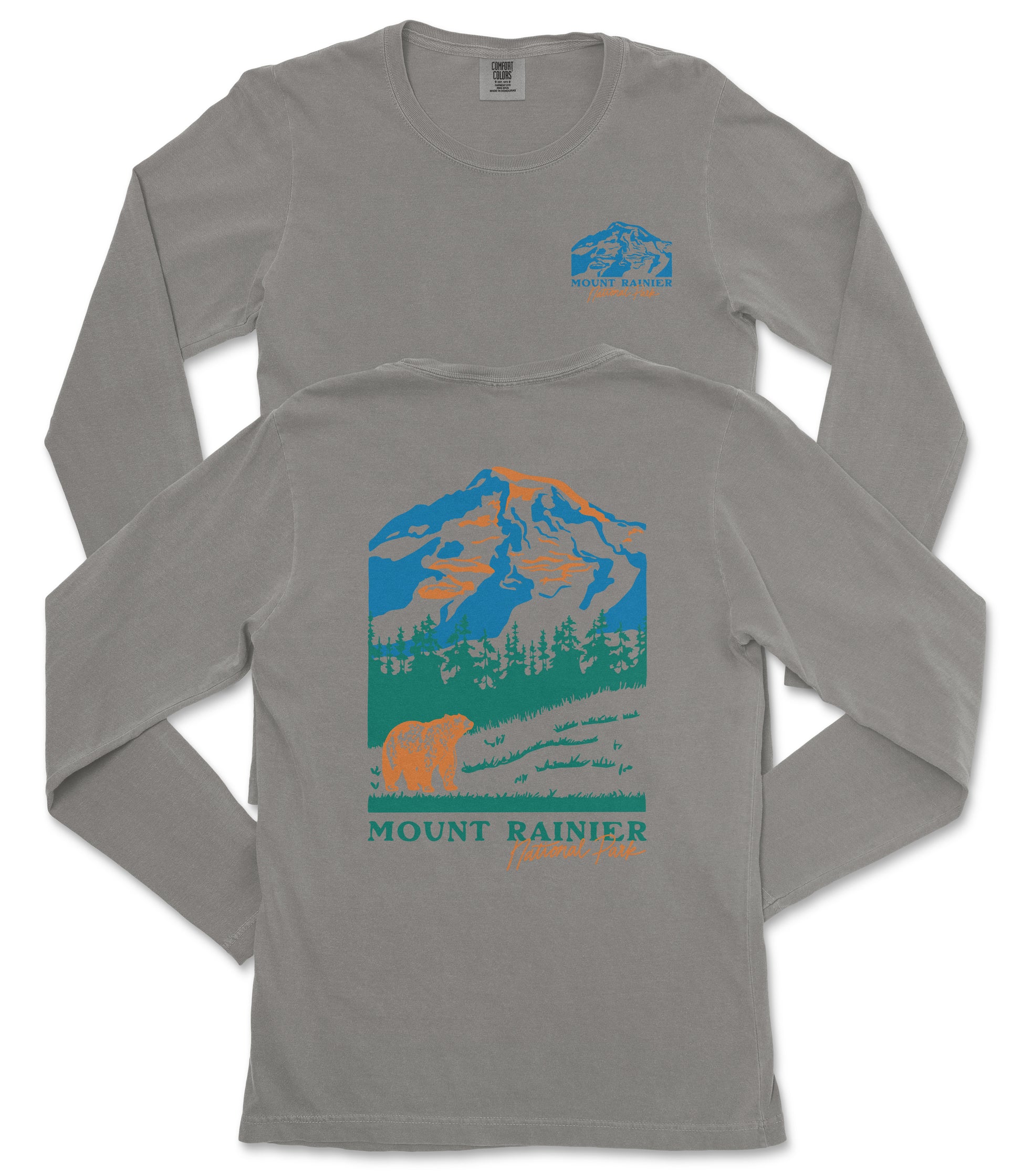 a gray long-sleeved t-shirt with a graphic design depicting a mountain landscape, including a bear and trees. The text "MOUNT RAINIER" is printed below the mountain graphic.