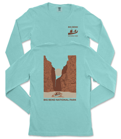 A turquoise long-sleeve t-shirt with a graphic design depicting a canyon and a boat, along with the text "BIG BEND NATIONAL PARK" printed on the back.