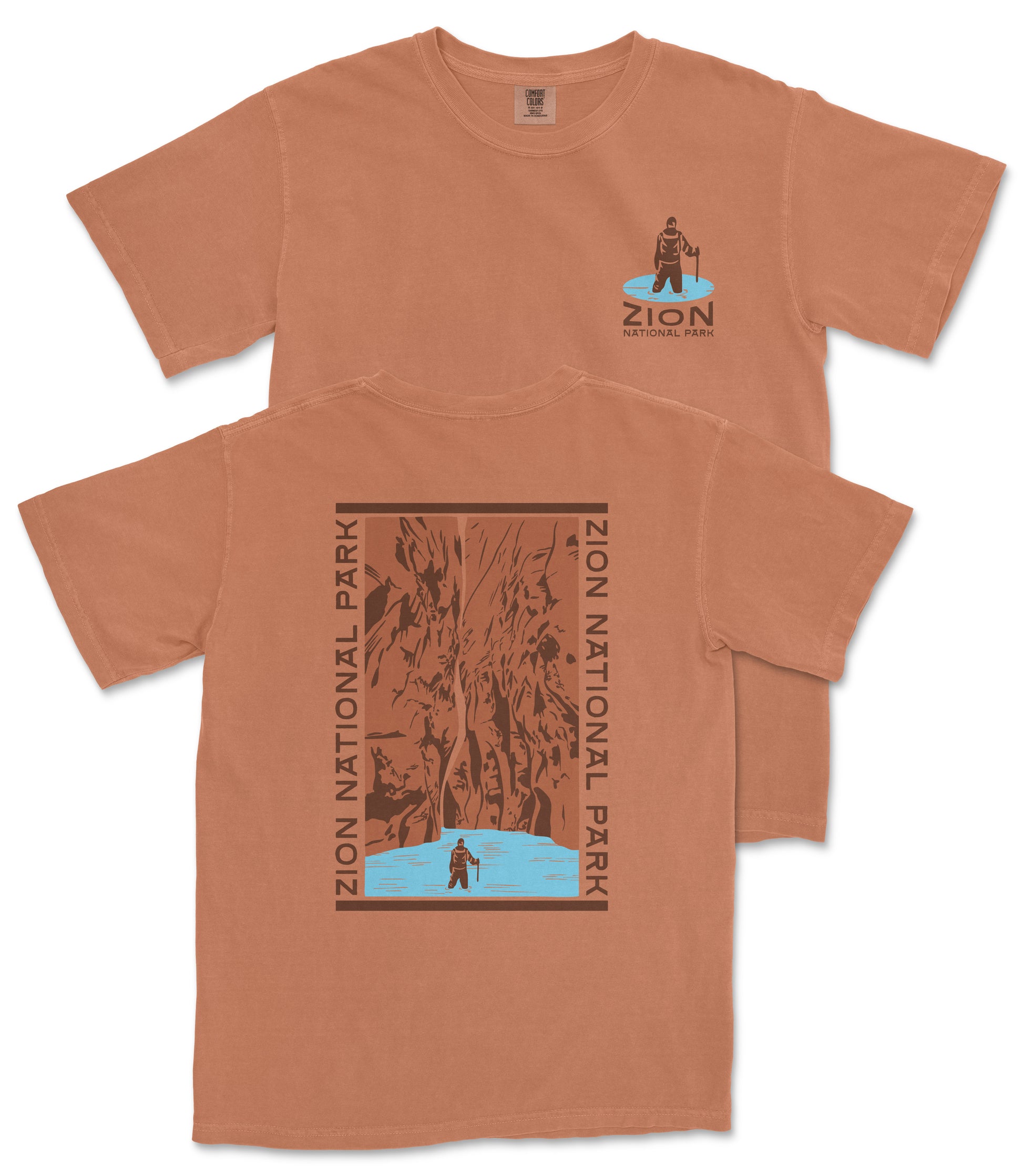 a brown t-shirt with a graphic design on the back, depicting a person standing in front of a waterfall.