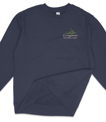 A navy blue long-sleeved shirt with a logo on the left side.