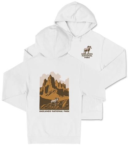 A white hooded sweatshirt with a graphic design depicting a mountain landscape and the text "Badlands National Park" printed on it.
