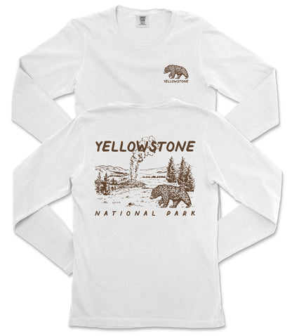 A white long-sleeved t-shirt with a graphic design depicting a bear and a landscape, along with the text "Yellowstone National Park" printed on it.