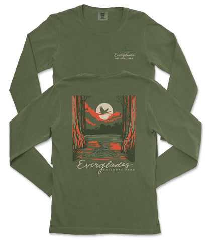 a green long-sleeved t-shirt with a graphic design depicting a sunset over a forest.