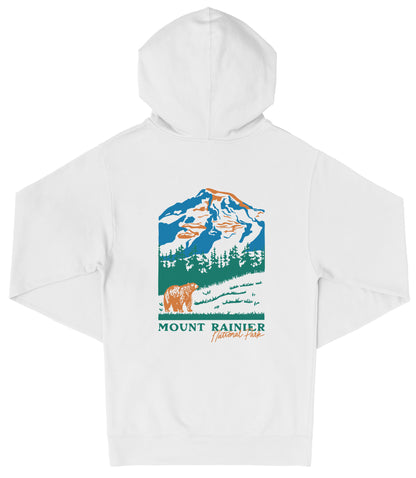 A white hooded sweatshirt with a graphic design depicting a mountain landscape with a bear in the foreground.