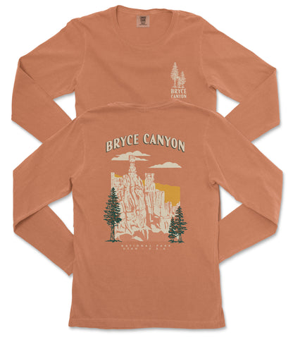 a long-sleeved orange t-shirt with a graphic design depicting Bryce Canyon National Park.