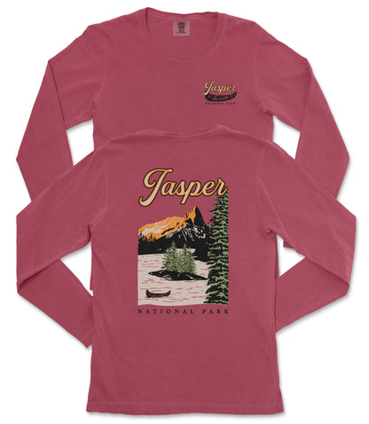 A red long-sleeved t-shirt with a graphic design depicting a scenic landscape, including mountains, trees, and a lake, along with the text "Jasper National Park" printed on it.