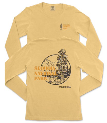 a yellow long-sleeved t-shirt with a graphic design depicting a sequoia tree and mountains, along with the text "SEQUOIA NATIONAL PARK" and "CALIFORNIA" printed on it.