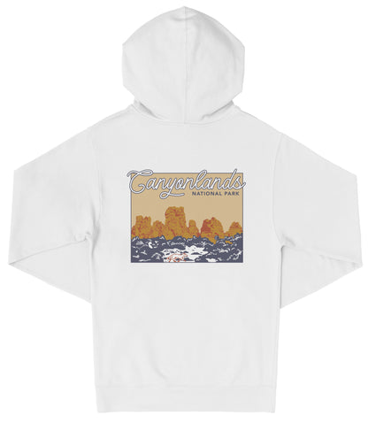 A white hooded sweatshirt with a graphic design depicting a scenic landscape with mountains and water.