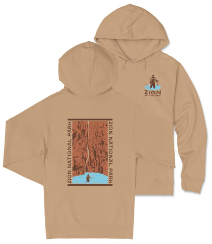 A beige hooded sweatshirt with a graphic design on the back, depicting a person climbing a mountain.