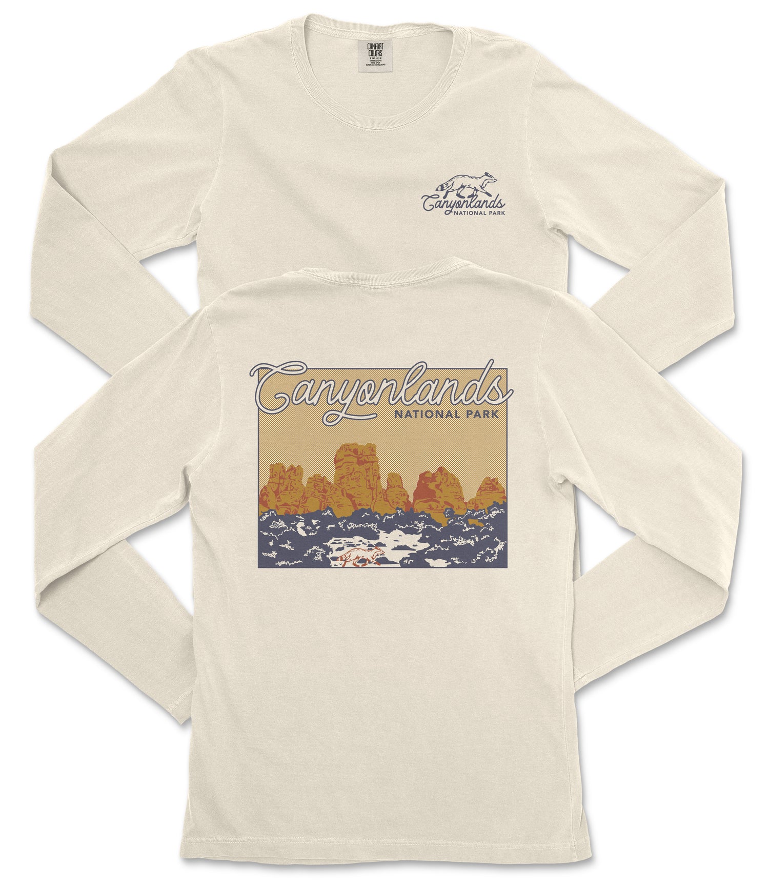 A white long-sleeved t-shirt with a graphic design depicting a scenic landscape, including mountains and a body of water.