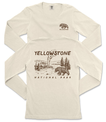 A cream-colored long-sleeved t-shirt with a graphic design depicting a bear and a landscape, along with the text "Yellowstone National Park" printed on the back.