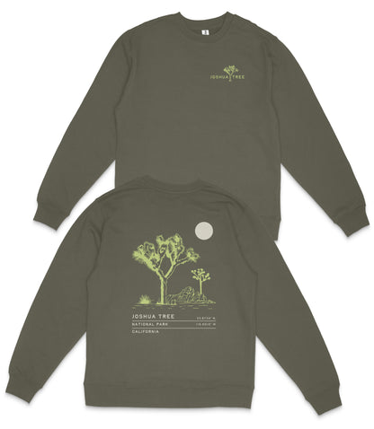 a grey sweatshirt with a graphic design on the back, depicting a tree and a moon.