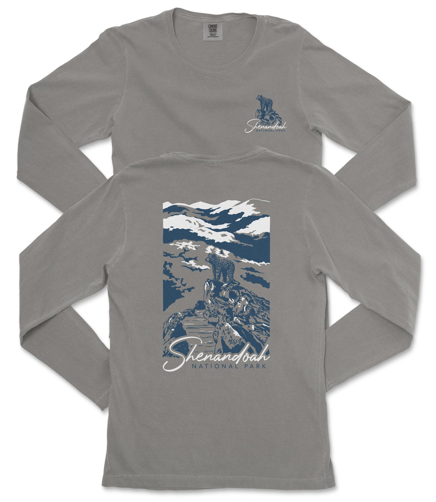 a gray long-sleeved t-shirt with a graphic design on the back. The design depicts a mountain landscape with a person standing on a rock. The text "Shenandoah National Park" is printed below the graphic.