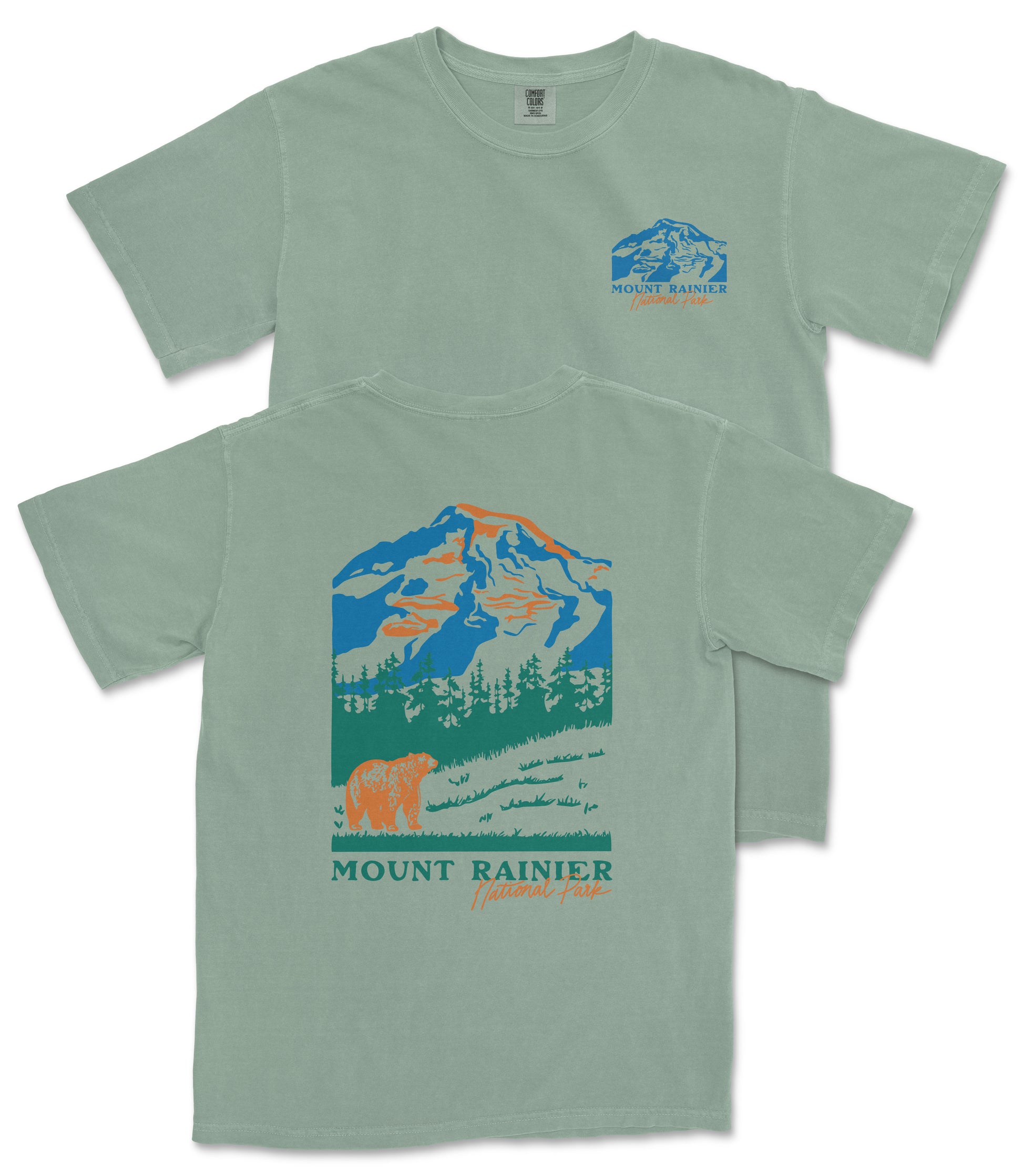 A green t-shirt with a graphic design depicting a mountain landscape, including a bear and trees, along with the text "Mount Rainier National Forest".
